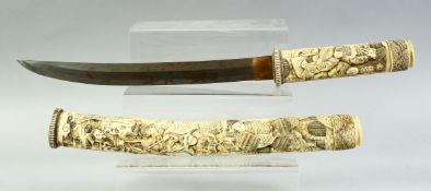 A GOOD QUALITY JAPANESE MEIJI PERIOD SECTIONAL IVORY TANTO, the sheath and handle well carved with