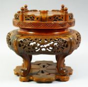 A LARGE CHINESE CARVED HARDWOOD STAND, 25cm high.