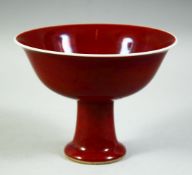 A CHINESE COPPER RED PORCELAIN STEM CUP, the inner foot rim with six character mark, bowl 15.5cm