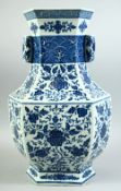 A LARGE CHINESE BLUE AND WHITE PORCELAIN TWIN HANDLE VASE, the body decorated with various flower