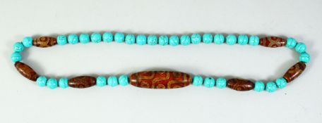 A CHINESE TURQUOISE AND DZI BEADED NECKLACE.