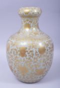 A GOOD CHINESE CELADON GLAZE AND GILT DECORATED GARLIC HEAD VASE, the body painted all over with