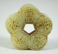A CHINESE CELADON JADE PENDANT, of lobed pentafoil form, decorated with auspicious characters, 2in