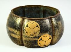A JAPANESE GOLD LACQUERED BRONZE LOBED JARDINIERE, the exterior with applied Tokugawa Clan mon, 20cm