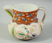 A TURKISH KUTAHYA GLAZED POTTERY COFFEE JUG, 9cm high.