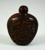 A SMALL CHINESE SNUFF BOTTLE AND STOPPER, possibly horn, with panels of a sage and deer, 7cm high.