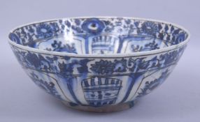 A LARGE 17TH/18TH CENTURY PERSIAN SAFAVID BLUE AND WHITE POTTERY BOWL, signed, 28cm diameter.