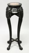 A CHINESE HARDWOOD AND MARBLE INSET CIRCULAR VASE STAND, with pierced and carved frieze and