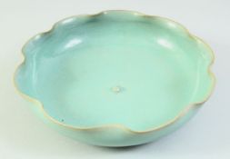 A CHINESE CELADON LILY PAD FORMED DISH, 20cm diameter.