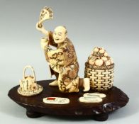 AN EARLY 20TH CENTURY JAPANESE CARVED IVORY OKIMONO, of a kneeling male figure at a tea ceremony,