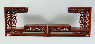 A PAIR OF CHINESE HARDWOOD RECTANULAR THREE TIER STANDS, 34.5cm long, 25cm high.
