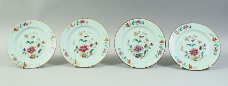 FOUR CHINESE FAMILLE ROSE PORCELAIN DISHES, each painted with flowers, 16.5cm diameter.