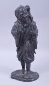 A JAPANESE MEIJI BRONZE FIGURE OF A MAN WITH A MONKEY, the figure standing upon a base with the