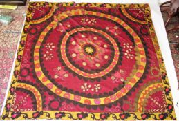 A VERY LARGE UZBEK SUZANI EMBROIDERED TEXTILE, embroidered with floral motifs.