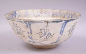 A LARGE PERSIAN TIMURID POTTERY BOWL, decorated with various stylised motifs, 22cm diameter.