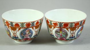 A PAIR OF CHINESE FAMILLE ROSE 'BARAGON TUMED' PORCELAIN CUPS, each cup enamelled with buddhistic