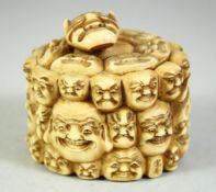 A JAPANESE CARVED IVORY NOH MASK BOX AND COVER, the box carved all over with various theatre masks