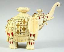 A JAPANESE MEIJI PERIOD CARVED IVORY MODEL OF A CAPARISONED ELEPHANT, circa 1880, onlaid all over