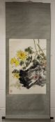 A 20TH CENTURY CHINESE HANGING SCROLL PAINTING ON PAPER, depicting yellow flowers, leafage and