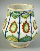 A TURKISH KUTAHYA GLAZED POTTERY VASE, 12cm high.