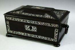 A FINE MOTHER OF PEARL INLAID EBONY CASKET, 23.5cm long.