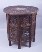 A GOOD MOORISH BONE INLAID CIRCULAR TABLE, carved with two bands of grape and vine and ornate