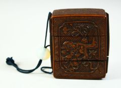 A CHINESE CARVED WOOD TWO CASE INRO, 9cm x 8cm.