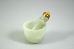 A SMALL INDIAN CARVED JADE CUP, 4cm diameter, together with a small jade snuff bottle, 5.5cm, (2).