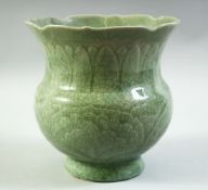A CHINESE CELADON GLAZE PORCELAIN VASE, with incised decoration under glaze, (af), 18cm high.
