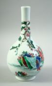 A SMALL CHINESE FAMILLE VERTE PORCELAIN BOTTLE VASE, decorated with various figures in an outdoor