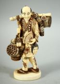 A JAPANESE CARVED IVORY OKIMONO, depicting a basket seller, with inset mother of pearl seal to base,