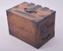 A 19TH CENTURY JAPANESE KEYAKI WOOD AND IRON MOUNTED ZENI-BAKO / MONEY BOX, with three drawers