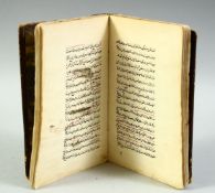 AN ISLAMIC LEATHER BOUND SCHOLAR'S ASTROLOGY BOOK, the book containing writings and various