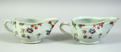 A PAIR OF 18TH CENTURY CHINESE FAMILLE ROSE PORCELAIN SAUCE BOATS, 16.5cm long.