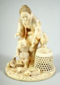 A FINE JAPANESE MEIJI PERIOD CARVED IVORY OKIMONO of an elderly lady with a child and chickens,