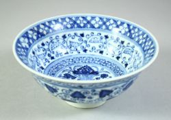 A CHINESE BLUE AND WHITE PORCELAIN BOWL, the interior with lotus, further decorated with bands of