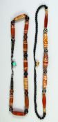 TWO DZI BEAD NECKLACES.