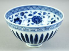 A CHINESE BLUE AND WHITE PORCELAIN BOWL, the interior decorated with large flower heads and