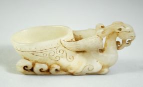 A GOOD CHINESE WHITE JADE PHOENIX LIBATION BOWL, of archaic form and design, 3.5in long & 1.5in