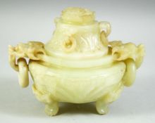 A CHINESE CARVED GREEN HARDSTONE TWIN HANDLE KORO AND COVER, carved with temple lions and ring