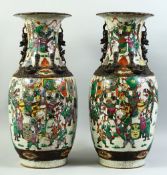A LARGE PAIR OF CHINESE CRACKLE WARE PORCELAIN VASES, painted with scenes of warriors, with