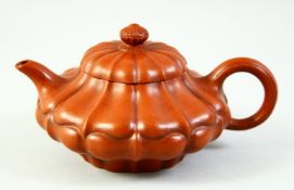 A CHINESE LOTUS FORMED YIXING TEAPOT, the inner lid and base with impressed marks, 16cm from spout