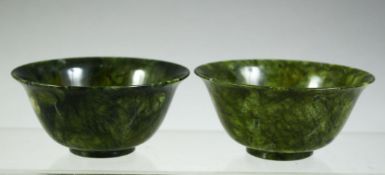 TWO CHINESE SPINACH GREEN JADE BOWLS, 10cm diameter.