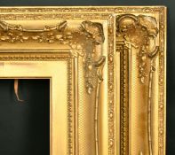 A pair of 19th Century gilt composition swept frames, rebate size each 10