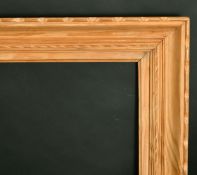 A carved pine frame, rebate size 26.5
