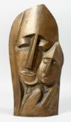Manner of Eric Gill, a wall mounted head study of a mother and child, bronze, 10.25