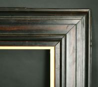 A moulded hard wood frame, rebate size 33