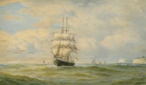 Charles Napier Hemy (1841-1917) A tall ship with wind in her sails off the coast with other
