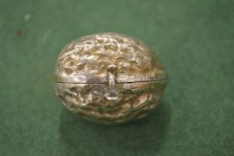 A continental silver nutmeg grater in the form of a walnut.