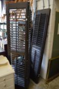 A pair of folding louvre shutter screens.
